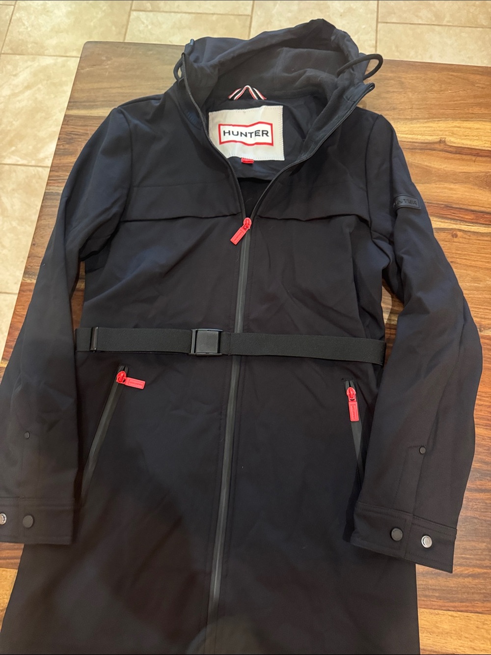 Hunter Black Hooded Waterproof Raincoat with Red Zip Accents. Size S